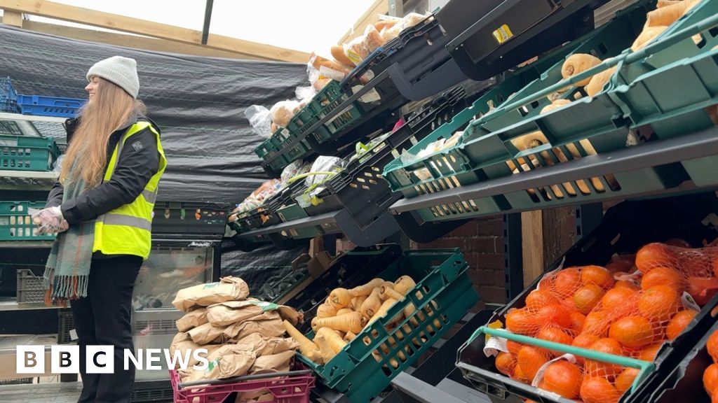 Closing factory workers paid to help at food bank