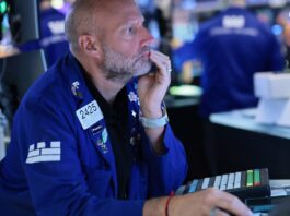 Dow rides into new week at record high. What investors are watching ahead