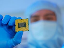 engineer holds microchip