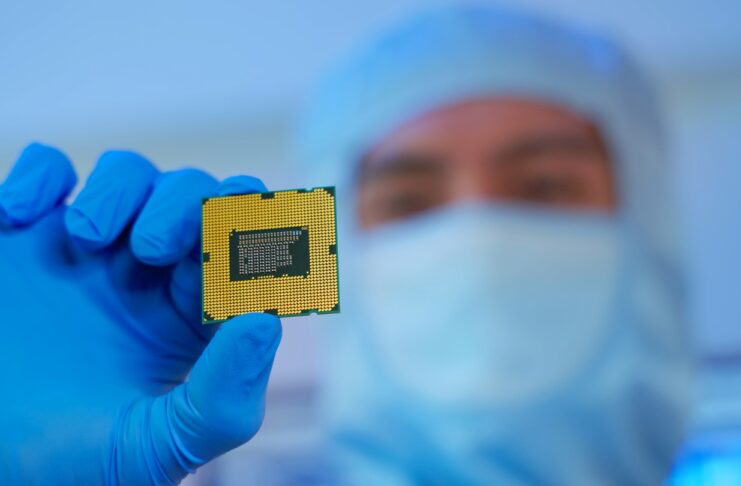 engineer holds microchip